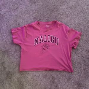 Got it from target , worn only twice! Cropped pink shirt with “Malibu” on it